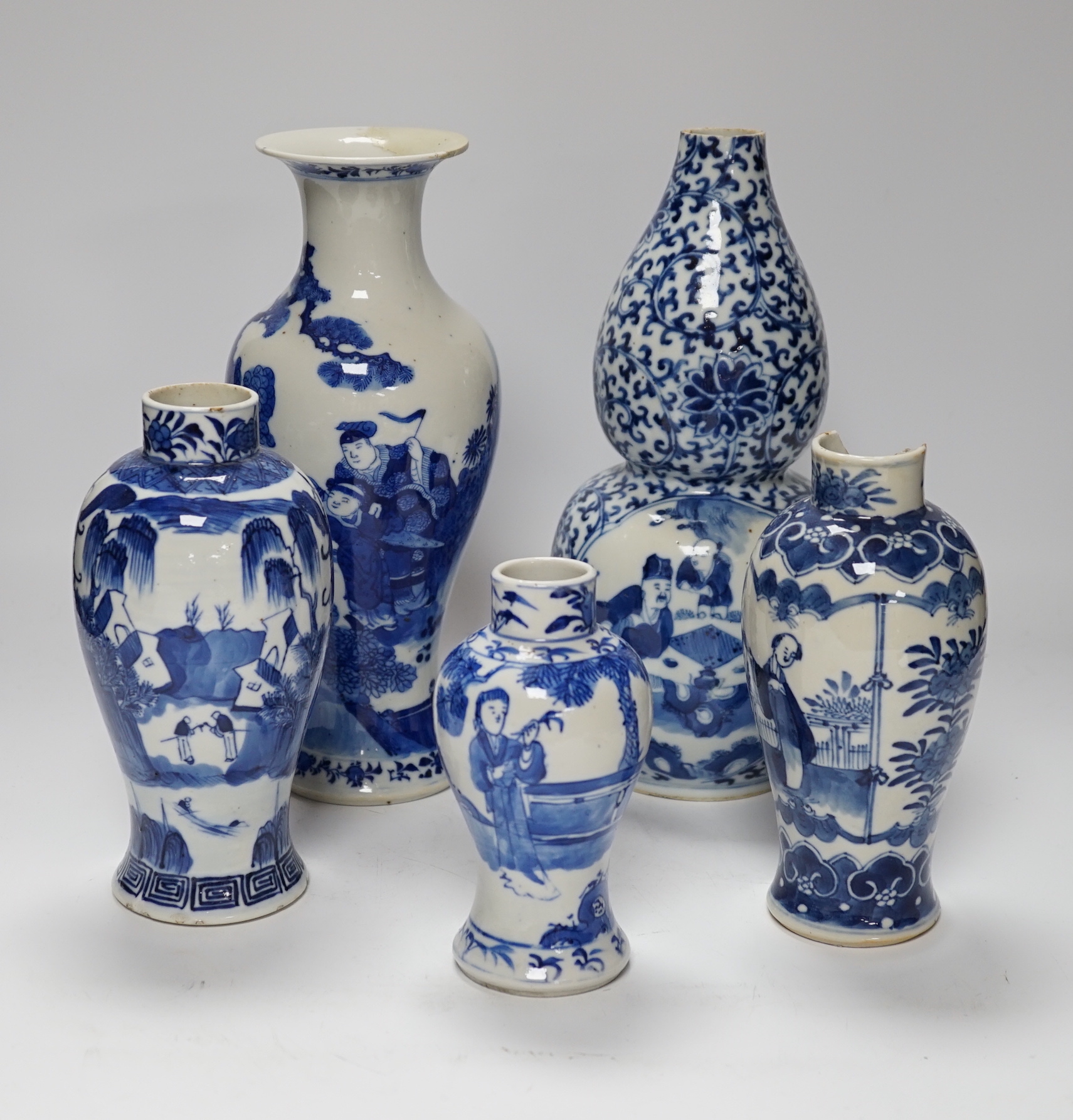 Five 19th century Chinese various sized blue and white figural vases, tallest double gourd vase 27cm high